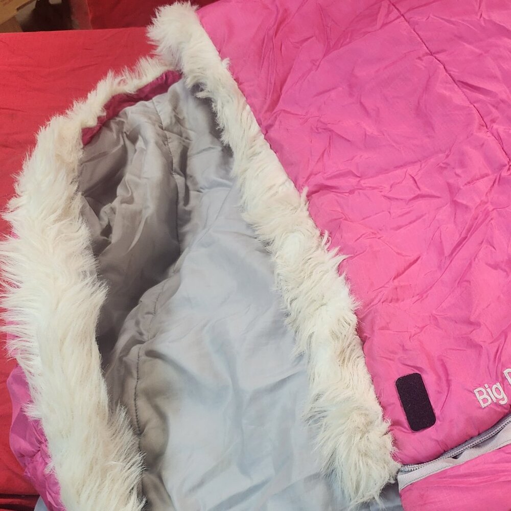 Girls Kelty Sleeping Bag with a sewed on stuff sack Pink in color rated for +30